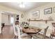 Bright dining room features hardwood floors, and a shelf for displaying decorative items at 528 S 8Th St, Lake Wales, FL 33853