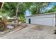 Spacious detached garage with a roll-up door and side entrance, perfect for storage or a workshop at 528 S 8Th St, Lake Wales, FL 33853