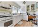 Charming kitchen with white cabinetry, a vintage stove, and ample countertop space at 528 S 8Th St, Lake Wales, FL 33853