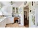 Bright kitchen with glass-front cabinets, a butcher block table, and stylish green trim at 528 S 8Th St, Lake Wales, FL 33853