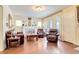 Cozy living room with hardwood floors, fireplace, comfortable seating, and arched windows at 528 S 8Th St, Lake Wales, FL 33853