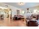 Cozy living room with hardwood floors, a decorative fireplace, and an open floor plan at 528 S 8Th St, Lake Wales, FL 33853