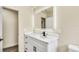 Bright bathroom vanity with a modern, lighted mirror and sleek black hardware at 628 Eastwood Ct, Altamonte Springs, FL 32714