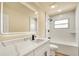 Modern bathroom featuring sleek vanity with quartz top, framed mirror, and tiled shower at 628 Eastwood Ct, Altamonte Springs, FL 32714