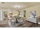 Elegant dining room with modern chandelier, wood floors, and modern furniture at 628 Eastwood Ct, Altamonte Springs, FL 32714