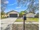 Charming single-story home with well-maintained lawn and attached two-car garage at 628 Eastwood Ct, Altamonte Springs, FL 32714