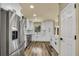 Bright kitchen features stainless appliances, white cabinets, subway tile backsplash at 628 Eastwood Ct, Altamonte Springs, FL 32714
