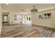 Open-concept living room featuring recessed lighting, wood flooring, and backyard access at 628 Eastwood Ct, Altamonte Springs, FL 32714
