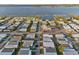 An aerial view of a mobile home community near a scenic lake at 6719 Canterbury Ne Dr, Winter Haven, FL 33881