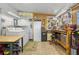 Well-organized garage with storage, shelving, and a work bench at 6719 Canterbury Ne Dr, Winter Haven, FL 33881