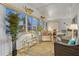 Sunroom featuring neutral decor, comfortable seating, and plenty of natural light at 6719 Canterbury Ne Dr, Winter Haven, FL 33881