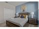 Comfortable bedroom with a full bed, stylish decor, and natural light at 718 Whistling Straits Blvd, Davenport, FL 33896