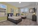 Bright bedroom featuring two twin beds, soft carpet, and natural light from two large windows at 718 Whistling Straits Blvd, Davenport, FL 33896