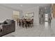 Bright dining area featuring a wooden table with seating and stylish decor at 718 Whistling Straits Blvd, Davenport, FL 33896