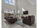 Inviting living area features high ceilings, plenty of seating, and natural light at 718 Whistling Straits Blvd, Davenport, FL 33896