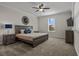 Serene main bedroom featuring a comfortable bed, nightstands, modern ceiling fan, and TV at 718 Whistling Straits Blvd, Davenport, FL 33896