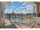 Inviting screened-in pool area with outdoor seating, offering a relaxing retreat with a view at 718 Whistling Straits Blvd, Davenport, FL 33896