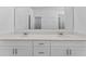 A bathroom with a double vanity and a large mirror at 7521 Stone Creek Trl, Kissimmee, FL 34747