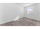 A small bedroom with neutral carpet at 7521 Stone Creek Trl, Kissimmee, FL 34747