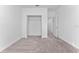 Bedroom features neutral carpet and walk-in closet at 7521 Stone Creek Trl, Kissimmee, FL 34747
