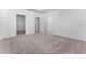 Bright bedroom offers neutral carpet, closet and ensuite bathroom access at 7521 Stone Creek Trl, Kissimmee, FL 34747