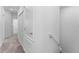 A hallway with neutral walls and carpet at 7521 Stone Creek Trl, Kissimmee, FL 34747