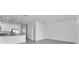 Bright living area open to kitchen featuring gray tile flooring at 7521 Stone Creek Trl, Kissimmee, FL 34747