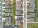 Aerial view of rooftops and neighborhood streets in a residential community at 7641 Modica St, Clermont, FL 34714