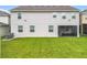 A view of the backyard with a well-maintained lawn and spacious screened-in lanai at 7641 Modica St, Clermont, FL 34714