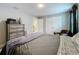 Cozy bedroom with neutral tones, dresser, and double closets at 7641 Modica St, Clermont, FL 34714