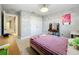 Spacious bedroom features a large closet, carpet, and natural light at 7641 Modica St, Clermont, FL 34714