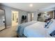 Spacious main bedroom showcasing en-suite bathroom, seating area, and lots of closet space at 7641 Modica St, Clermont, FL 34714
