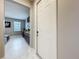 Inviting entryway featuring tile flooring and a view into the adjacent living room at 7641 Modica St, Clermont, FL 34714