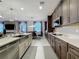 Spacious kitchen with modern appliances and a large island with seating, perfect for entertaining at 7641 Modica St, Clermont, FL 34714