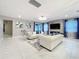 Bright and airy living room featuring stylish sofas, a unique lighting fixture, and contemporary decor at 7641 Modica St, Clermont, FL 34714