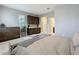 Bright main bedroom features a kitchenette, and access to the ensuite bathroom at 7641 Modica St, Clermont, FL 34714