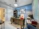 Bright office featuring a large desk, decorative accents, and an adjacent bathroom at 7641 Modica St, Clermont, FL 34714