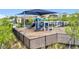 A fenced-in community playground featuring slides, climbing structures, and bench seating at 7641 Modica St, Clermont, FL 34714
