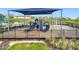 Community playground area featuring slides, climbing structures, and a shaded canopy at 7641 Modica St, Clermont, FL 34714