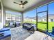 Relaxing screened-in porch with outdoor seating and views of the backyard at 7641 Modica St, Clermont, FL 34714