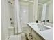 Stylish bathroom with a tub, shower, vanity, and modern finishes at 7670 Otterspool St, Kissimmee, FL 34747