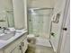 Modern bathroom with a glass-enclosed shower, sleek vanity, and neutral color palette at 7670 Otterspool St, Kissimmee, FL 34747