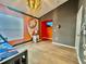 Themed bedroom with bunk beds, Star Wars decor, and modern lighting at 7670 Otterspool St, Kissimmee, FL 34747