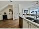 Well-lit kitchen showcasing white countertops, stainless steel appliances, and ample cabinet space at 7670 Otterspool St, Kissimmee, FL 34747