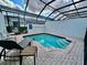 Inviting screened-in pool area with lounge chairs and a peaceful ambiance at 7670 Otterspool St, Kissimmee, FL 34747