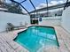 Refreshing screened-in pool with clear blue water and ample space for relaxation at 7670 Otterspool St, Kissimmee, FL 34747