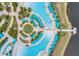 Birds-eye view of pool area with lounge seating, umbrellas and a nearby dock to the waterway at 8012 Lost Shaker Ln, Kissimmee, FL 34747