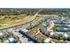 Aerial view of a colorful planned residential community, showing the streetscape and landscaping at 8012 Lost Shaker Ln, Kissimmee, FL 34747