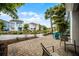 Community view from a patio, featuring a paver patio, landscaping, and neighborhood homes at 8012 Lost Shaker Ln, Kissimmee, FL 34747
