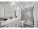 Clean bathroom with glass framed shower, white cabinets, and modern fixtures at 8012 Lost Shaker Ln, Kissimmee, FL 34747